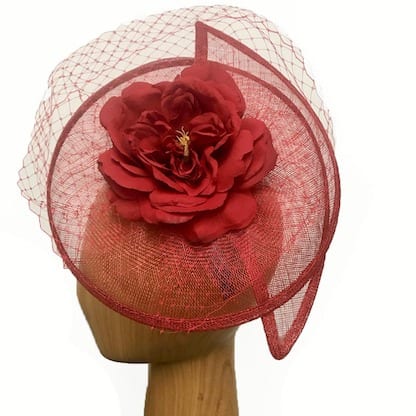 red fascinator with flower