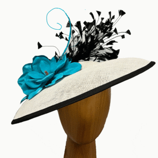 White saucer fascinator with turquoise and black