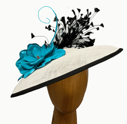 White saucer fascinator with turquoise and black