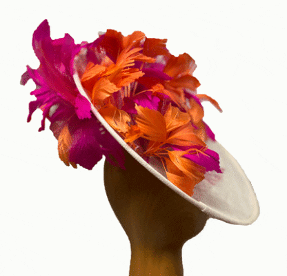 Ivory fascinator with orange and fuchsia feathers