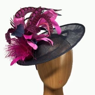 navy blue fascinator with multiple pink fuchsia feathers
