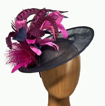 navy blue fascinator with multiple pink fuchsia feathers