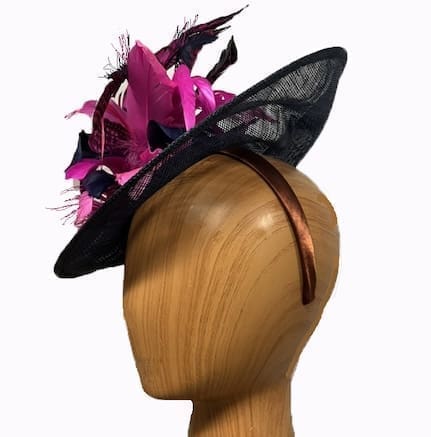 navy blue fascinator with multiple pink fuchsia feathers