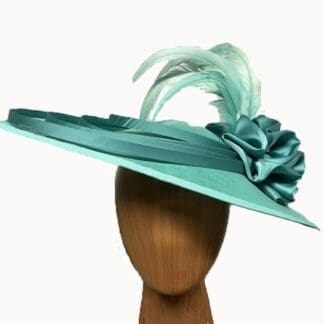 bright mint green fascinator hat with feathers